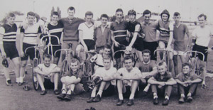 Group of cyclists posing formally
