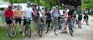 Group of recreational cyclists lined up in a caravan park